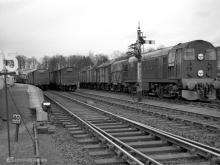 D8028 waits in the Yard while D8029 BLOCKS both roads on the mainline with its train, Huntly, Apr 1961