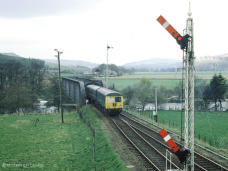 A mixed livery Cravens passes the up home at signal at Craigellachie as it heads north,