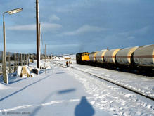 A class 25 with its partner already run round prepares to take liquified gas tanks from Inverurie station back to Port Elphinstone paper mill in this undated winter scene