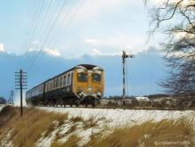 A refurbished class 120 Swindon DMU passes the down distant signal for Inverurie in the winter of 1978