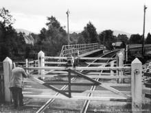Nethy Bridge Station gates are closed behind a railbus service on 25 Aug 1964