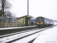 Pitmedden 5 Dec 1964, the crossing keeper is carrying oil for the signal lamps, the destination of the Cravens is unknown.